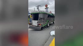 Wonky bus ready for scrap year carries passengers in the Philippines