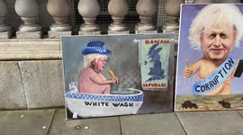 Artist displays satirical paintings of Boris Johnson outside Downing Streett ahead of Partygate committe grilling