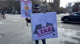 Anti-Boris Johnson protesters gather in London ahead of Partygate committe grilling