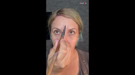 'That's lovely!' - Artist impressively paints her face in a symmetrical floral design