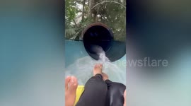 Woman stuck in waterslide when her inflatable stops mid-way