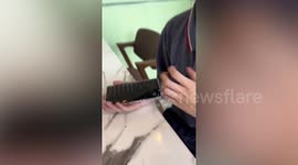 Blind worker shows off how he uses his smartphone in Malaysia