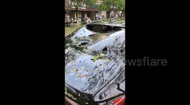 Residents flee away as powerful hailstorm damages cars and roofs in southern China