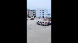 Amused students, science teacher launch water rocket into space