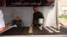 Palestinian men prepare ''Qatayef'', traditional pancakes that are popular during Muslim holy month of Ramadan, in Gaza city