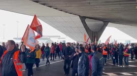 Throng of pension protesters strike at Paris Charles de Gaulle Airport