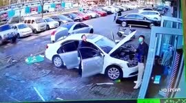 Glass window narrowly misses man after falling down from building in China
