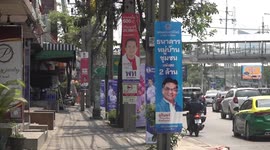 Election campaign posters line roads as former Man City owner takes on military 'dictator'