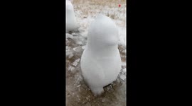 Mom builds DOZENS OF SNOW PENGUINS after kids refuse to play with her on snow day