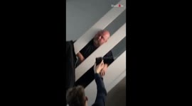 Man gets his head hilariously stuck between the stair railing
