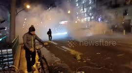 Trash cans fires and gas during protests against pension reform in Paris, France