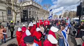 Demonstrators dressed as handmaids protest Benjamin Netanyahu's visit to Downing Street