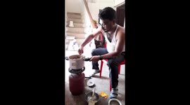 Indian young  boys cooking meat  in home with presser cooker .