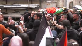 Palestinians carry the body of Tariq Maali 42, during his funeral in the West Bank city of Ramallah.