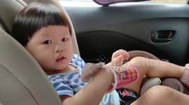 Funny toddler stuck her hand in YAN YAN CHOCOLATE box
