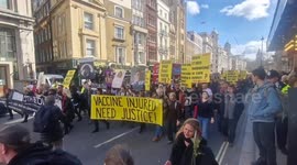 Confetti cannons fired and red roses thrown during vaccine injury protest outside BBC headquarters