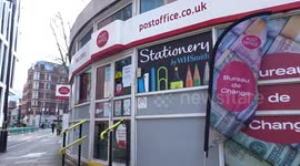 Gusts of wind wave the flags outside post office in Westminster