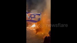 Israeli flags flown amidst fires as thousands take to streets