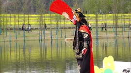 An Actor Performs Face-changing in Sichuan Opera During Rape Flower Festival In Yichang, China