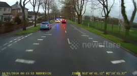 A Parked Police car? Suddenly sets off and nearly wipes out a passing car