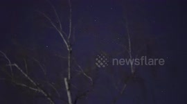 (4K) 56 Starlink satellites flying across swiss skies at dawn twilight , 4 days after Florida launch