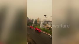 Hapless Thai officials spray water hoses towards sky in futile attempt to control air pollution