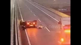 Motorists jump out of moving car on Chinese highway after believing vehicle would explode