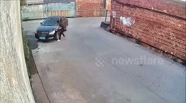 Motorist failing to turn car gets out vehicle to drag it along road in China