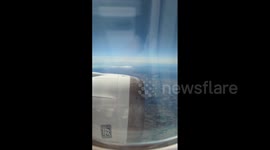 Clouds of smoke billowing from forest fire seen from plane over Spain's Castellon