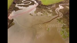 Aerial footage captures oilfield leak damage in Poole Harbour, England