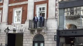 Privacy case: onlookers follow High Court events from a Fleet Street balcony