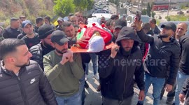 Mourners carry the body of Palestinian Amir Loulah, succumbed to the wounds he sustained by Israeli gunfire during his funeral