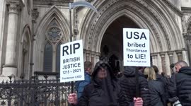 Julian Assange supporter dressed as 'death with a sickle' seen outside the Royal Courts of Justice in London
