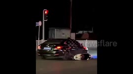Brake up! Man clings to hood of girlfriend's car in attempt to stop her from leaving