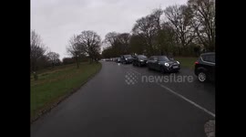Motor traffic queues in Richmond park during the morning rush hour