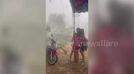 Tropical storm damages market stalls in northern Thailand