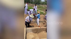 Locals dig up skeletons to scrub them clean in bizarre ritual in Thailand