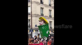 Macron image at the protest against pension reform in Paris, France