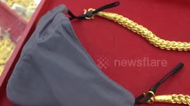 Thai jewellery shop makes face masks with gold chain straps