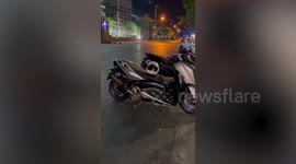 Enormous wild python caught hiding inside motorcycle