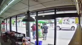 Distracted delivery man smashes face into glass door in store
