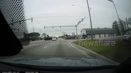 Close Call: White Volkswagen Runs Red Light and Almost Hits a Black Pick-up Truck