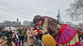 A giant puppet 'Little Amal', representing a refugee child delights Londoners as she wanders around the City