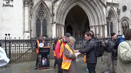 Just Stop Oil activists enjoy music, food and dance outside the Royal Courts of Justice in London