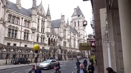 Just Stop Oil activists rallying to music outside the Royal Courts of Justice