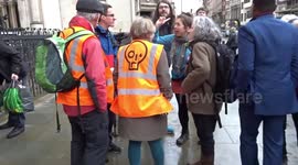 Just Stop Oil activists support Lawyers Are Responsible group outside the Royal Courts of Justice in London