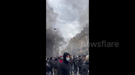 Smoke covers streets of Paris, France during pension reform protest