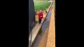 Happy kid's water-jumping stunt ends in a sloppy way