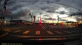 Dash cam catches person in large pickup truck running red traffic light and refusing to brake.