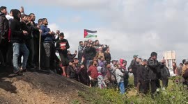 Palestinians take part in a rally near the fence east of Gaza city marking the 47th anniversary of Land Day